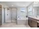 Modern bathroom featuring a walk-in shower and soaking tub at 19445 Redwood Point Dr, Tampa, FL 33647