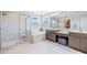 Elegant bathroom with a soaking tub, glass shower and dual vanities at 19445 Redwood Point Dr, Tampa, FL 33647