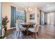 Bright breakfast nook with a round table, view to the covered and screened lanai, with lots of natural light at 19445 Redwood Point Dr, Tampa, FL 33647