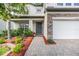 Inviting entryway with a stone walkway, well-maintained landscaping, and a 'Welcome' doormat at 19445 Redwood Point Dr, Tampa, FL 33647