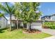Charming two-story home with a two-car garage, manicured landscaping, and a paver driveway at 19445 Redwood Point Dr, Tampa, FL 33647
