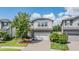 Charming two-story home with a well-manicured lawn and a paved driveway at 19445 Redwood Point Dr, Tampa, FL 33647