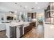 Contemporary kitchen with stainless appliances, stone countertops, tile flooring, and open to the living and dining rooms at 19445 Redwood Point Dr, Tampa, FL 33647
