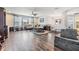 Open-concept living room features hardwood floors, ceiling fan and views to other rooms at 19445 Redwood Point Dr, Tampa, FL 33647