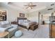 Spacious main bedroom with tray ceiling, ceiling fan, and furniture at 19445 Redwood Point Dr, Tampa, FL 33647