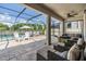 Expansive screened-in outdoor patio with comfortable seating, dining area, and view of the pool, perfect for entertaining at 19445 Redwood Point Dr, Tampa, FL 33647