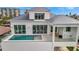 Waterfront home with covered pool and deck overlooking landscaped backyard at 20 Bellevue Dr, Treasure Island, FL 33706