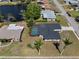 An aerial view of the single-story home featuring a screened pool, and spacious lawn at 2008 41St W St, Bradenton, FL 34205