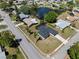 A single-story home featuring a screened pool, tropical trees and a spacious lawn at 2008 41St W St, Bradenton, FL 34205