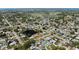 An aerial view of a neighborhood with mature trees, a pond, golf course and single Gathering homes at 2008 41St W St, Bradenton, FL 34205