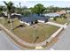 Aerial view of single story home featuring a spacious corner lot, mature trees and two car garage at 2008 41St W St, Bradenton, FL 34205