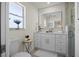Modern bathroom featuring a vanity with lots of storage space and large, lighted mirror at 2008 41St W St, Bradenton, FL 34205