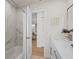 Bright bathroom showcasing white marble shower, modern fixtures, and access to living areas at 2008 41St W St, Bradenton, FL 34205