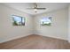 Bright bedroom with wood floors and two large windows offering plenty of natural light at 2008 41St W St, Bradenton, FL 34205