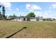 Charming single-story home featuring a well-manicured lawn and a two-car garage and green entry door at 2008 41St W St, Bradenton, FL 34205