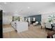 An expansive open floorplan featuring a modern kitchen with a large quartz countertop island at 2008 41St W St, Bradenton, FL 34205