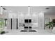 Modern kitchen featuring stainless steel appliances, quartz countertops, and ample cabinet space at 2008 41St W St, Bradenton, FL 34205