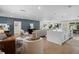 Open concept living room and kitchen area with hardwood floors and plenty of natural light at 2008 41St W St, Bradenton, FL 34205