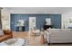 Modern living room with stylish blue accent wall and contemporary furnishings at 2008 41St W St, Bradenton, FL 34205