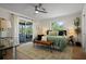 Serene main bedroom features a sliding glass door leading to a screened patio and a neutral decor at 2008 41St W St, Bradenton, FL 34205