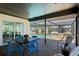 Screened patio with an outdoor dining area and lounge chairs offering views of the pool at 2008 41St W St, Bradenton, FL 34205