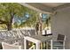 Relaxing balcony seating area with a view of lush foliage at 201 W Laurel St # 212, Tampa, FL 33602