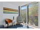 Comfortable seating area with balcony access providing views of the exterior and nearby building at 201 W Laurel St # 212, Tampa, FL 33602