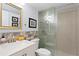 Updated bathroom with glass shower, modern vanity, and tiled accent wall, creating a sleek and stylish design at 201 W Laurel St # 212, Tampa, FL 33602