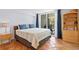 Comfortable bedroom with balcony access, neutral decor, tiled floors, and ample natural light at 201 W Laurel St # 212, Tampa, FL 33602