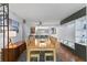 Dining area leads to an open floorplan with kitchen access, built in storage and tile flooring at 201 W Laurel St # 212, Tampa, FL 33602
