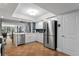 Modern kitchen features stainless steel appliances, white cabinets, and a convenient breakfast bar at 201 W Laurel St # 212, Tampa, FL 33602