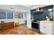 Renovated kitchen showcases terra cotta floors, white cabinets, and stainless steel appliances at 201 W Laurel St # 212, Tampa, FL 33602