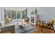 Inviting living room featuring a fireplace, tile floors, balcony access, and comfortable seating at 201 W Laurel St # 212, Tampa, FL 33602