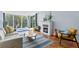 Cozy living room featuring a fireplace, tile floors, balcony access, and a comfortable seating area at 201 W Laurel St # 212, Tampa, FL 33602