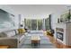 This living room is bathed in natural light and features tile floors and a fireplace at 201 W Laurel St # 212, Tampa, FL 33602