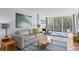 Comfortable living room featuring a sofa, accent chairs, tile floors, and access to an outdoor balcony at 201 W Laurel St # 212, Tampa, FL 33602