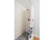 Shower with modern tile, shower head and fixtures with contrasting stone look shower flooring at 201 W Laurel St # 212, Tampa, FL 33602