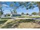 Driveway leading up to one story home at 209 E Lutz Lake Fern Rd, Lutz, FL 33549