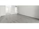 Living room with gray carpet, white walls, white closet and white door at 220 Belleview Blvd # 209, Belleair, FL 33756