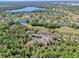 Panoramic aerial showing community, lake and golf course in a mature setting at 2206 Preservation Dr # 2206, Plant City, FL 33566