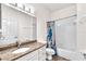 Bright bathroom featuring granite counters, a tub, and neutral tile floors at 2206 Preservation Dr # 2206, Plant City, FL 33566