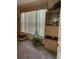 Serene bedroom featuring carpet floors, a display cabinet, and a tranquil window view at 2206 Preservation Dr # 2206, Plant City, FL 33566