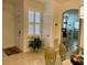 Bright foyer with tiled floors, indoor plant and view to dining area at 2206 Preservation Dr # 2206, Plant City, FL 33566