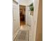 Hallway featuring tiled floors with an area rug and view into another room at 2206 Preservation Dr # 2206, Plant City, FL 33566