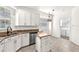 Well-lit kitchen with white cabinets, stainless appliances, and a kitchen island at 2206 Preservation Dr # 2206, Plant City, FL 33566