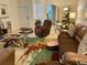 Warm living room with comfortable seating, stylish rug, and view to front entry and dining area at 2206 Preservation Dr # 2206, Plant City, FL 33566