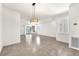 Open living area with large windows, tiled floor, and contemporary light fixture at 2206 Preservation Dr # 2206, Plant City, FL 33566