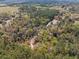 Aerial view of heavily wooded acreage, highlighting privacy and natural surroundings at 22295 Powell Rd, Brooksville, FL 34602