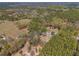 Aerial view of property nestled amongst trees with expansive yard at 22295 Powell Rd, Brooksville, FL 34602