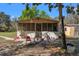 View of a screen patio and a house in the backyard at 22295 Powell Rd, Brooksville, FL 34602